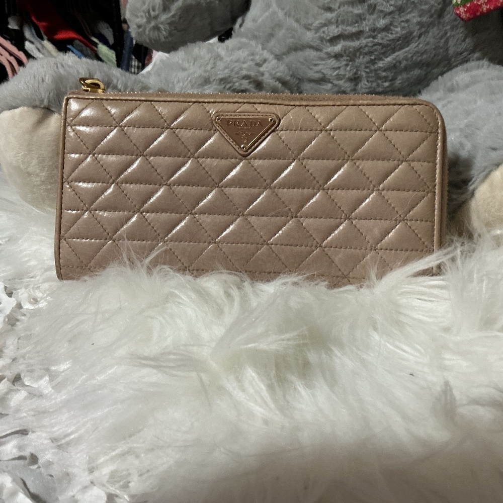 Woman’s faux Prada wallet